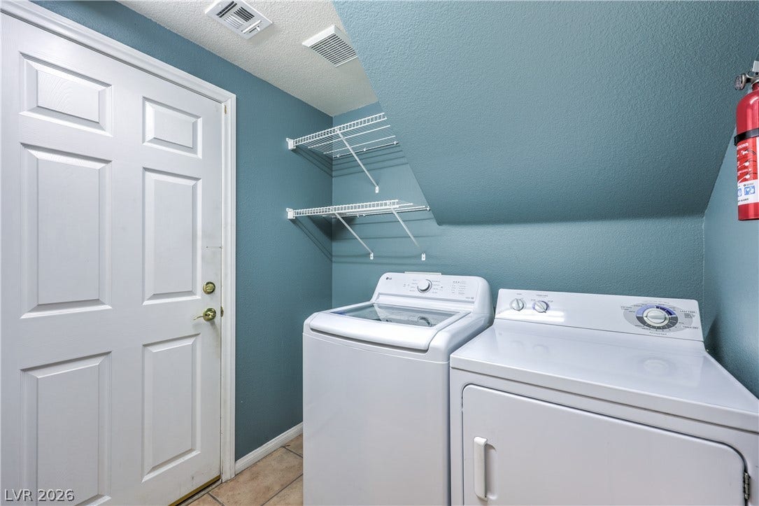 10744 Teton Village Court, Henderson, NV 89052 Functional tile flooring and built-in wire shelving maximize storage space in this utility area.
