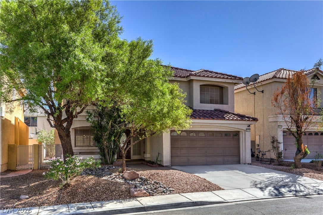 10744 Teton Village Court, Henderson, NV 89052 Spanish tile roofing and an attached garage define this suburban desert residence.