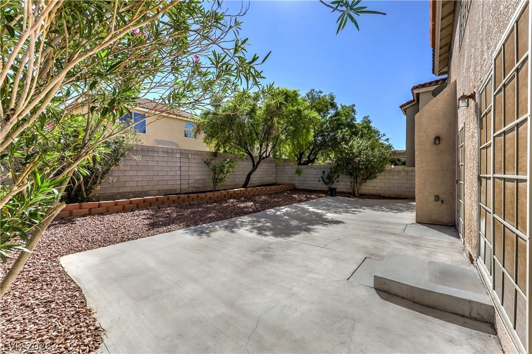 10744 Teton Village Court, Henderson, NV 89052 An expansive concrete patio provides the perfect foundation for outdoor dining and entertaining.