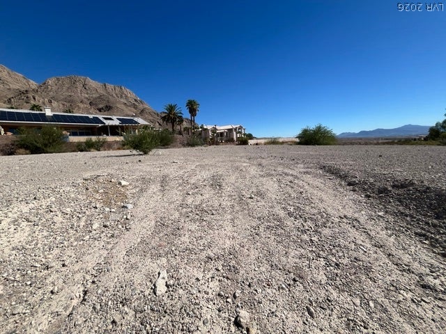 520 Los Feliz Street, Las Vegas, NV 89110 Rugged terrain frames a scenic backdrop of distant mountains under a clear blue sky.