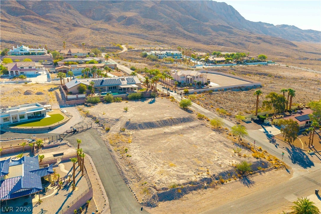 520 Los Feliz Street, Las Vegas, NV 89110 A spacious vacant lot sits nestled below a majestic mountain range in a quiet neighborhood.