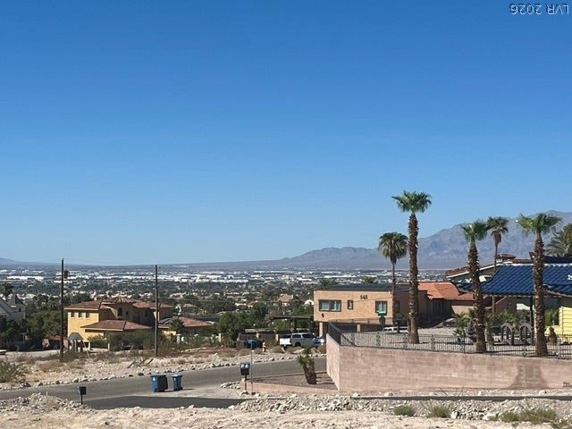 520 Los Feliz Street, Las Vegas, NV 89110 Distant mountains frame the horizon beyond a quiet desert neighborhood setting.