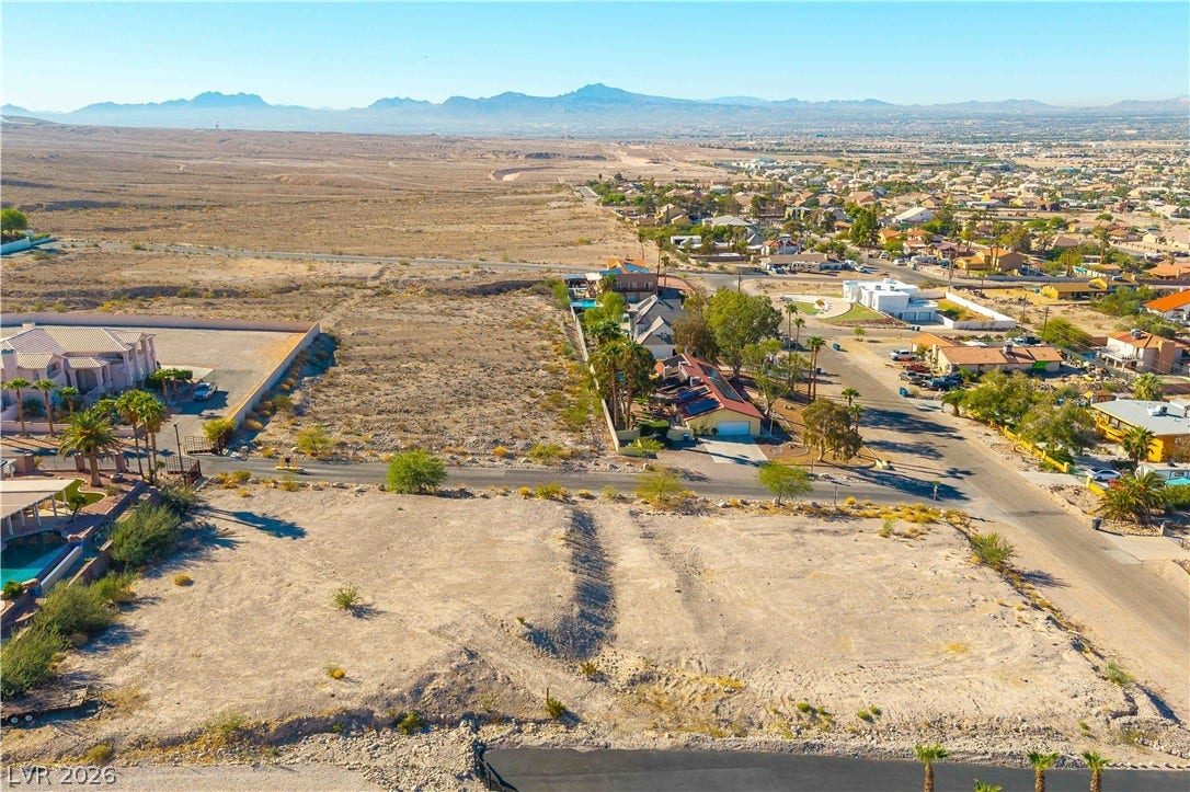 520 Los Feliz Street, Las Vegas, NV 89110 Sweeping mountain vistas frame this desert land parcel, offering limitless possibilities for your future vision.