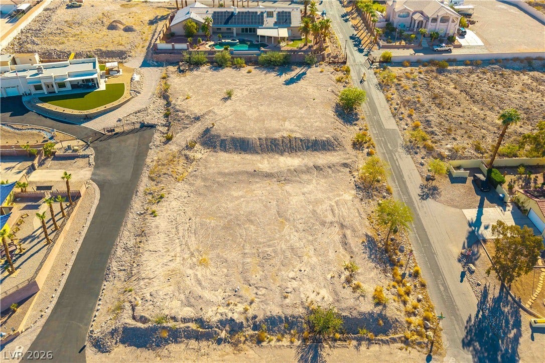 520 Los Feliz Street, Las Vegas, NV 89110 An expansive desert lot presents a blank canvas bordered by paved neighborhood streets.