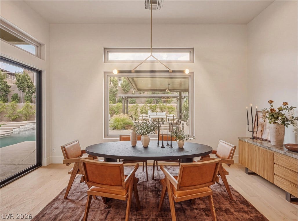 4 El Macero Court, Henderson, NV 89052 High ceilings and clean architectural lines define this welcoming dining space overlooking the pool.