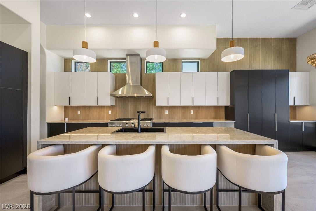 18 Wade Hampton Trail, Henderson, NV 89052 Clean lines and a spacious waterfall island define this contemporary culinary workspace.