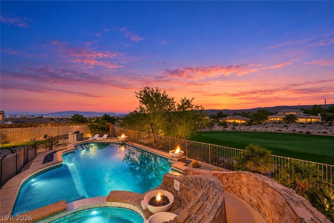 18 Wade Hampton Trail, Henderson, NV 89052 Virtually Staged.
A sparkling swimming pool overlooking the lush golf course under a vibrant twilight sky.
