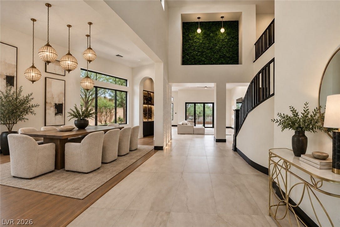 18 Wade Hampton Trail, Henderson, NV 89052 Virtually Staged.
High ceilings and dual flooring materials define this grand open-concept layout.