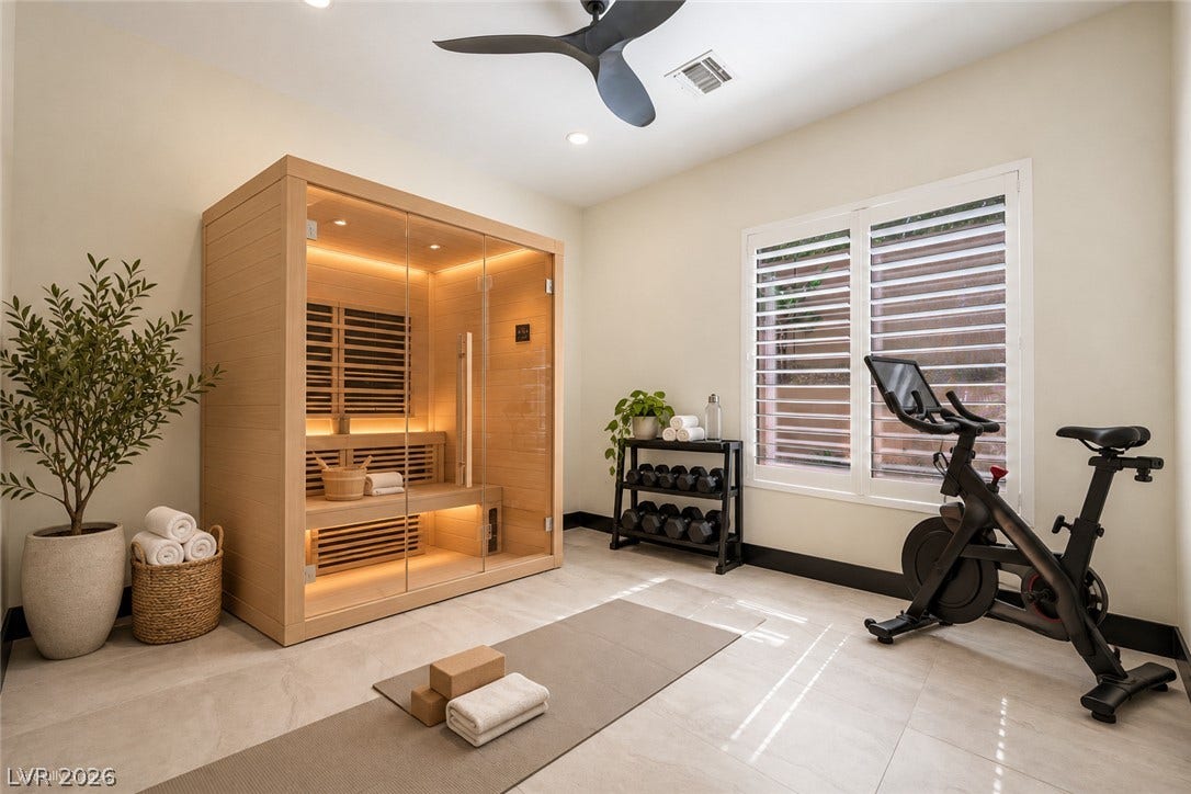 18 Wade Hampton Trail, Henderson, NV 89052 Virtually Staged.
An integrated home wellness space highlights smooth tile flooring and plantation shutters.