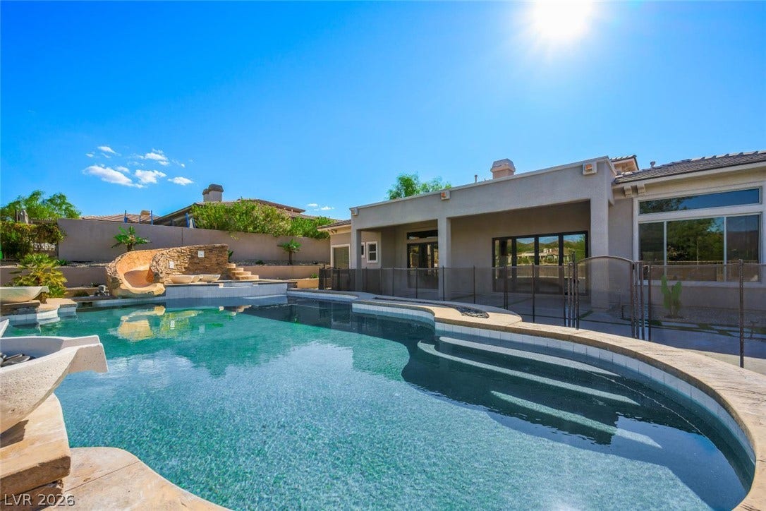 18 Wade Hampton Trail, Henderson, NV 89052 An inviting swimming pool acts as the centerpiece of this private backyard retreat.
