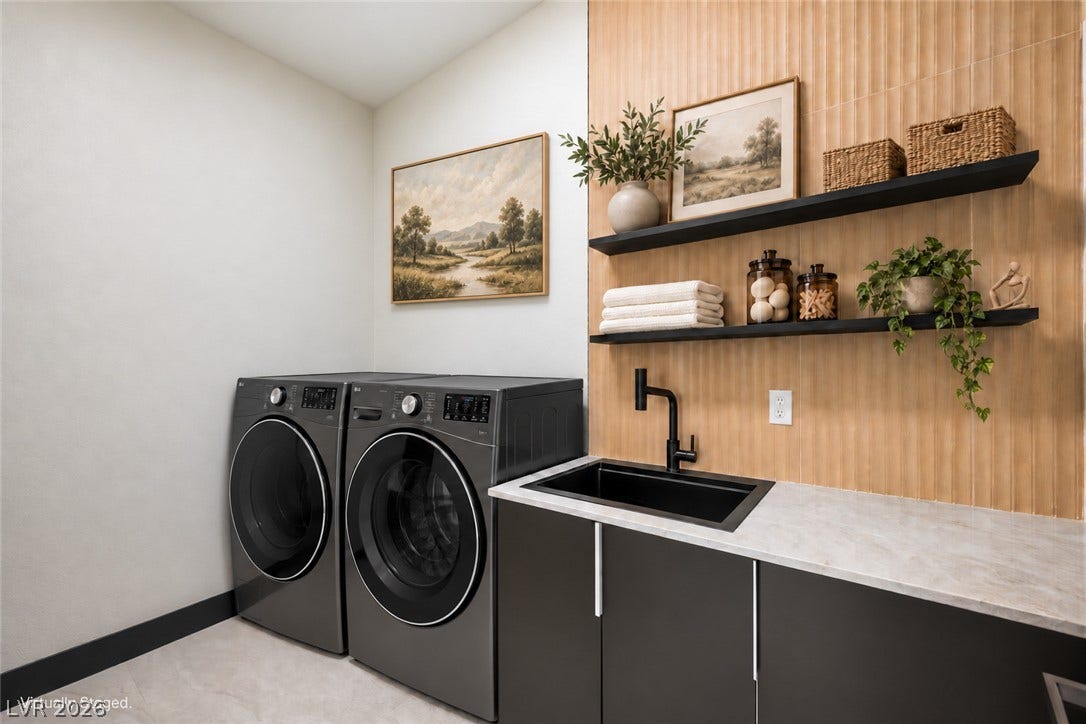 18 Wade Hampton Trail, Henderson, NV 89052 Virtually Staged.
A modern utility space features stylish cabinetry and integrated laundry appliances.