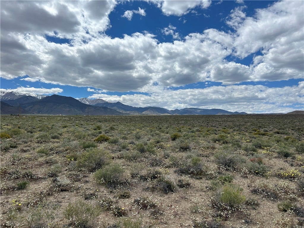 233 MOUNTAIN WATER RANCH, Dyer, NV 89010 Sweeping mountain vistas frame this open desert acreage under a dramatic blue sky.