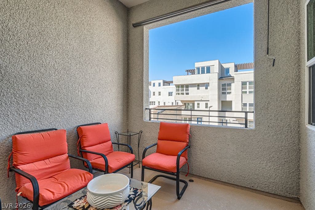2507 Silent View Avenue, Henderson, NV 89044 Textured stucco walls enclose a private covered balcony overlooking the surrounding neighborhood architecture.