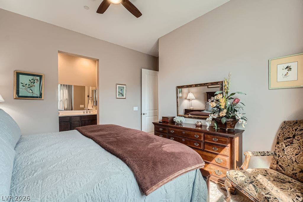 2507 Silent View Avenue, Henderson, NV 89044 An open doorway leads from this carpeted bedroom directly into the private master bathroom.