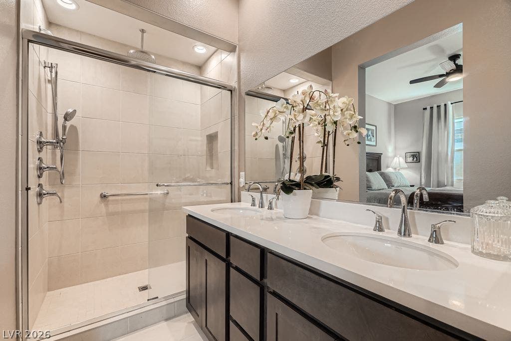 2507 Silent View Avenue, Henderson, NV 89044 Clean lines and a spacious glass-enclosed shower define this updated bath.