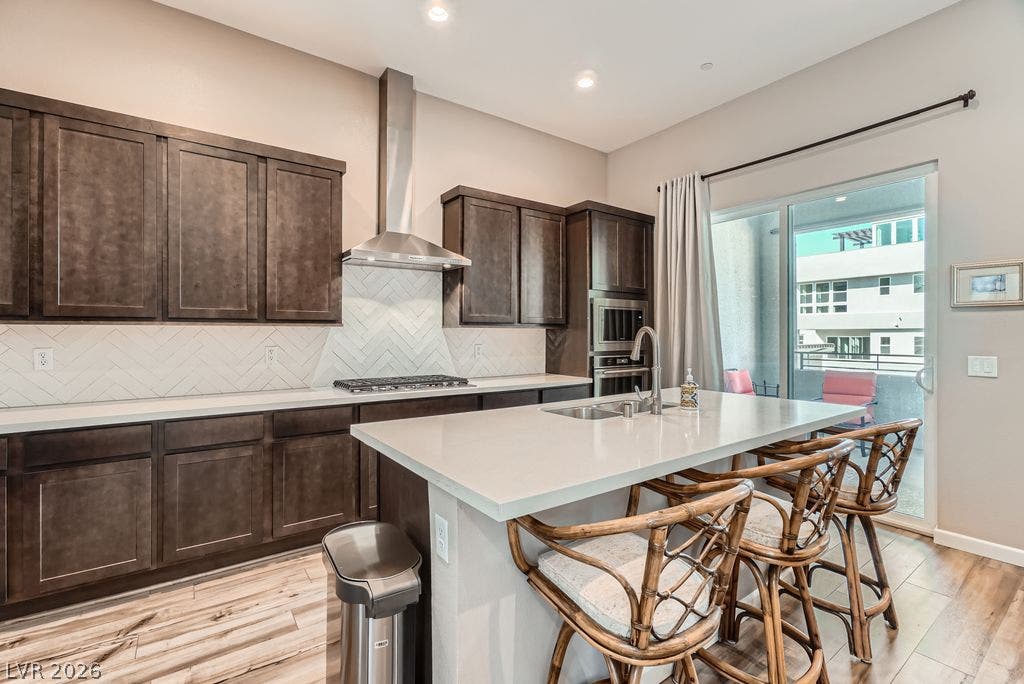 2507 Silent View Avenue, Henderson, NV 89044 Rich wood cabinetry paired with pristine stone countertops defines this open culinary space.