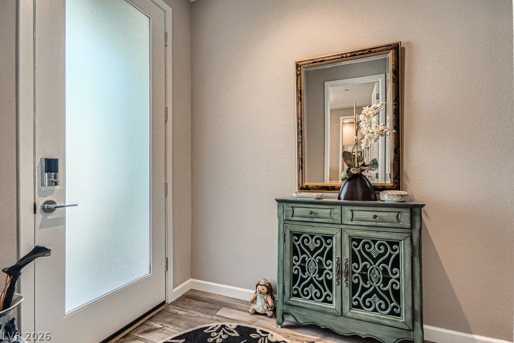 2507 Silent View Avenue, Henderson, NV 89044 A frosted glass door welcomes visitors into a welcoming entryway with wood-look flooring.