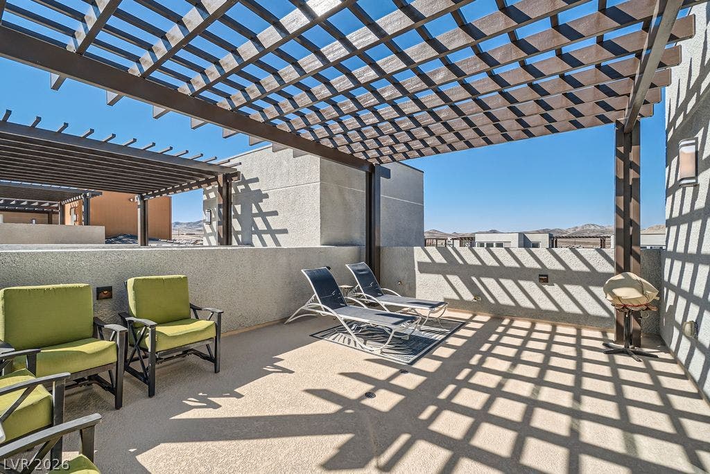2507 Silent View Avenue, Henderson, NV 89044 An open rooftop terrace features concrete flooring beneath a large wooden pergola structure.