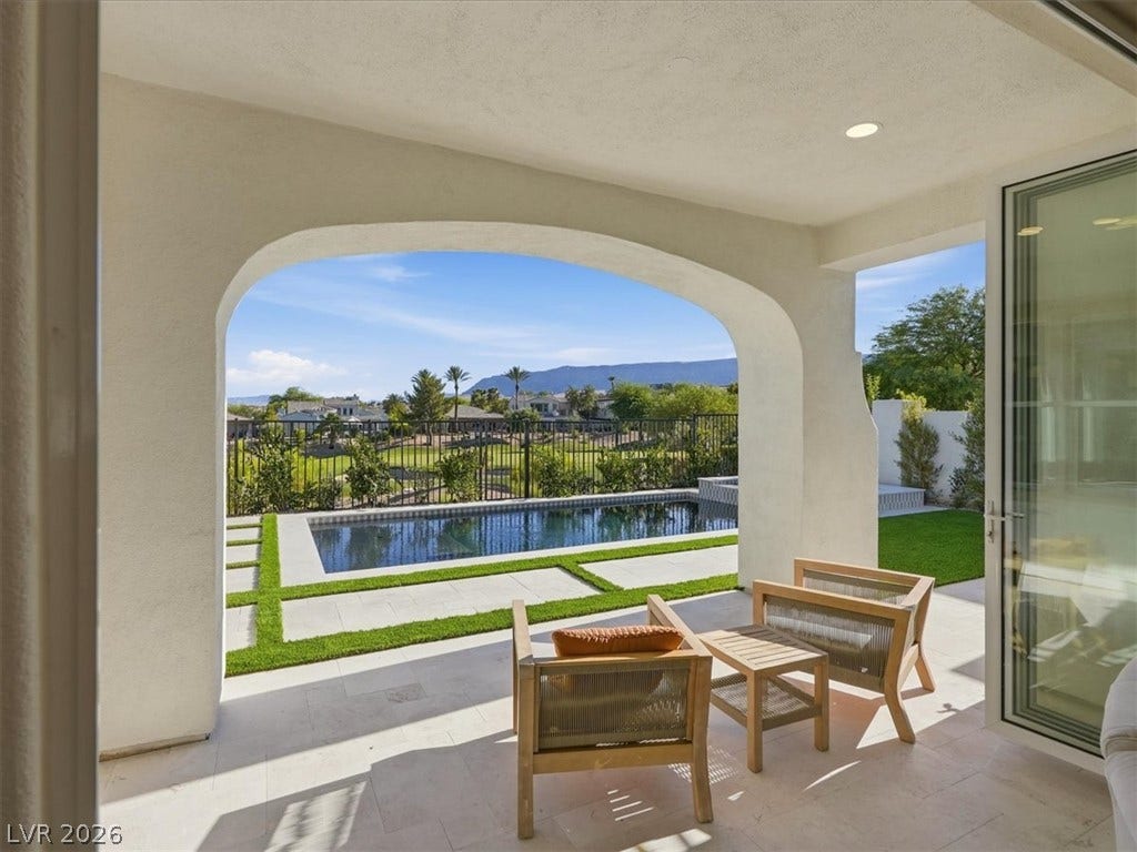 3074 Soft Horizon Way, Las Vegas, NV 89135 An inviting covered patio opens to a refreshing pool and manicured golf course vista.