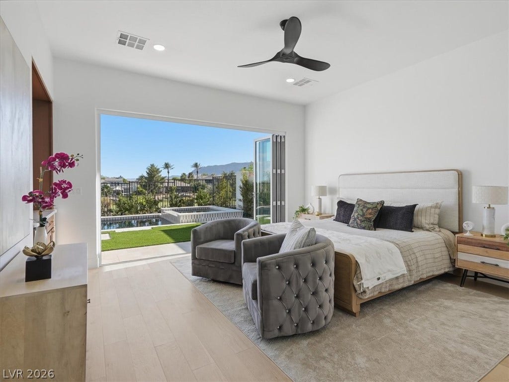 3074 Soft Horizon Way, Las Vegas, NV 89135 A spacious bedroom opens to a private pool and spa, offering a serene oasis.