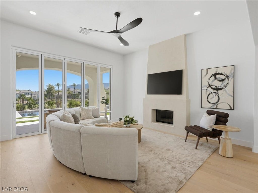 3074 Soft Horizon Way, Las Vegas, NV 89135 Floor-to-ceiling glass doors reveal a captivating view of the surrounding landscape and pool.