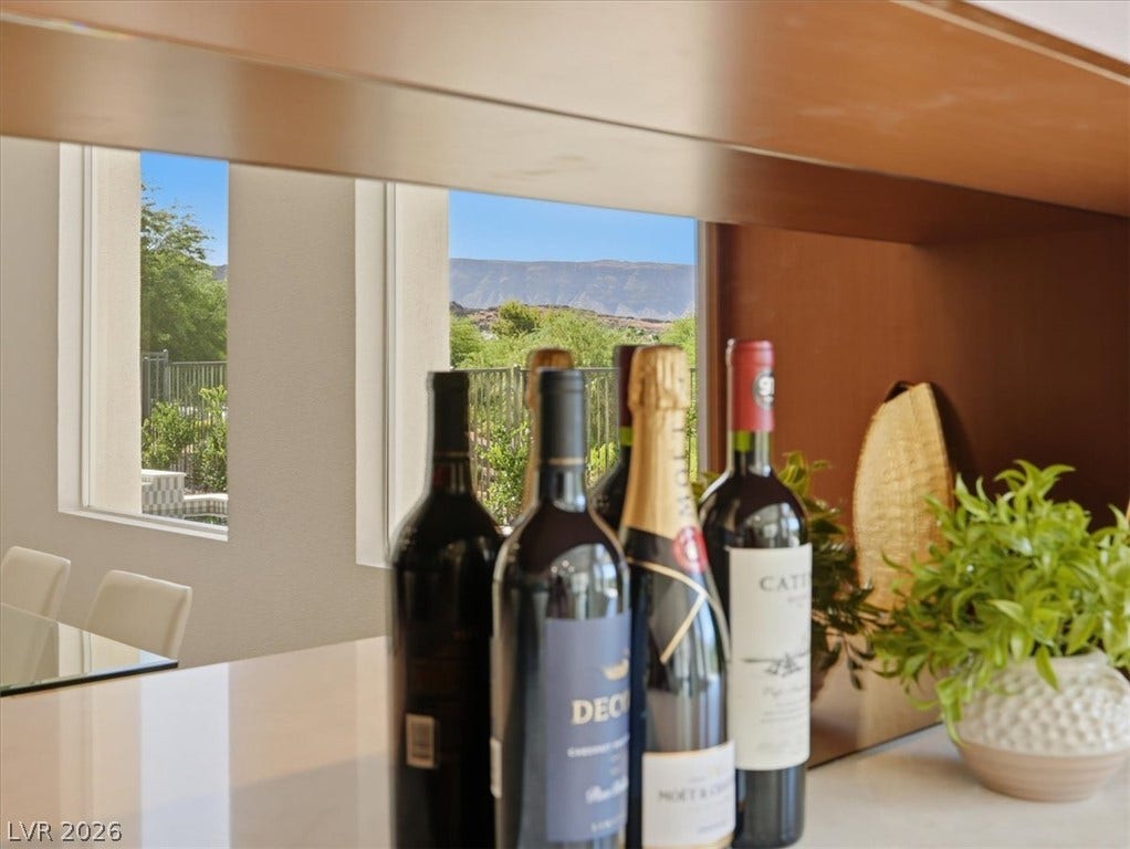 3074 Soft Horizon Way, Las Vegas, NV 89135 A well-lit kitchen with mountain views beyond the expansive windows.