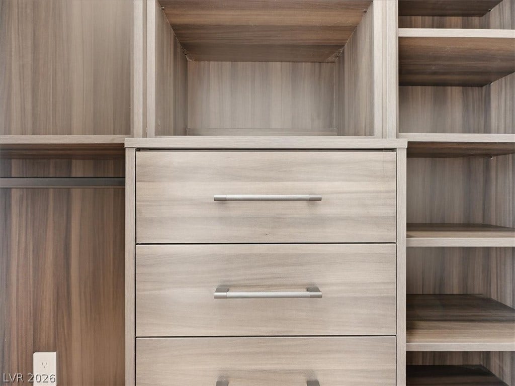 3074 Soft Horizon Way, Las Vegas, NV 89135 Customized closet system offers practical storage with varied shelving and drawers.