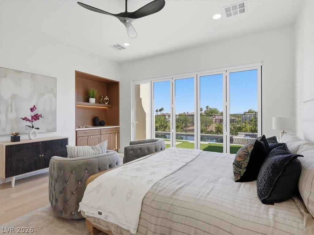 3074 Soft Horizon Way, Las Vegas, NV 89135 Retreat to a light-filled sleeping sanctuary featuring floor-to-ceiling glass doors and a chic integrated bar.