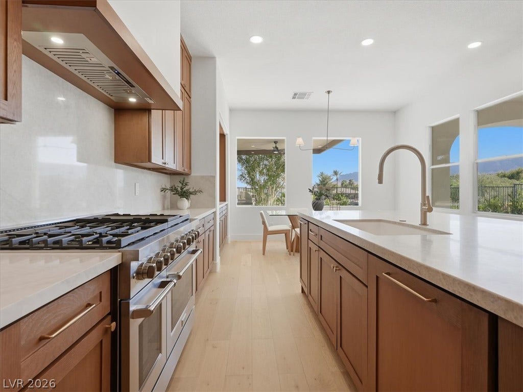 3074 Soft Horizon Way, Las Vegas, NV 89135 Gourmet kitchen with sleek appliances and generous counter space for culinary adventures.