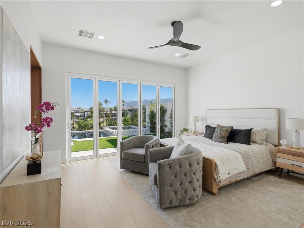 3074 Soft Horizon Way, Las Vegas, NV 89135 Retreat to this tranquil bedroom featuring a refreshing pool view and seamless outdoor access.