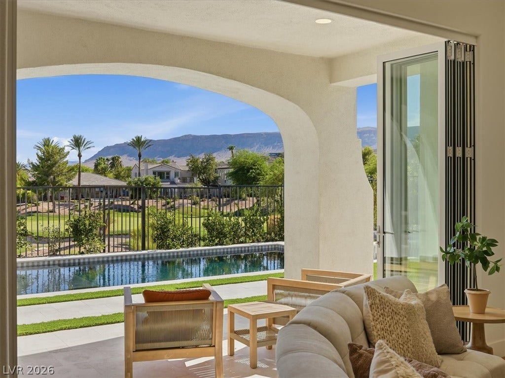 3074 Soft Horizon Way, Las Vegas, NV 89135 An inviting covered patio opens to a tranquil pool and garden with mountain views.