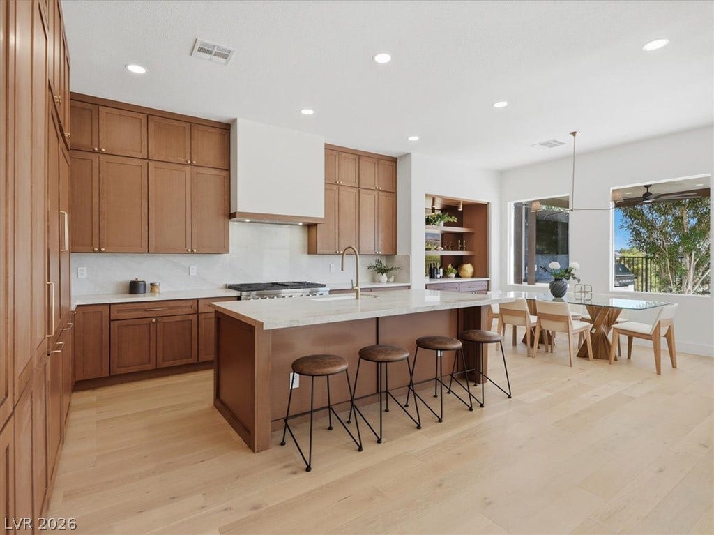 3074 Soft Horizon Way, Las Vegas, NV 89135 Culinary delights await in this modern kitchen with ample counter space and an adjacent dining area.
