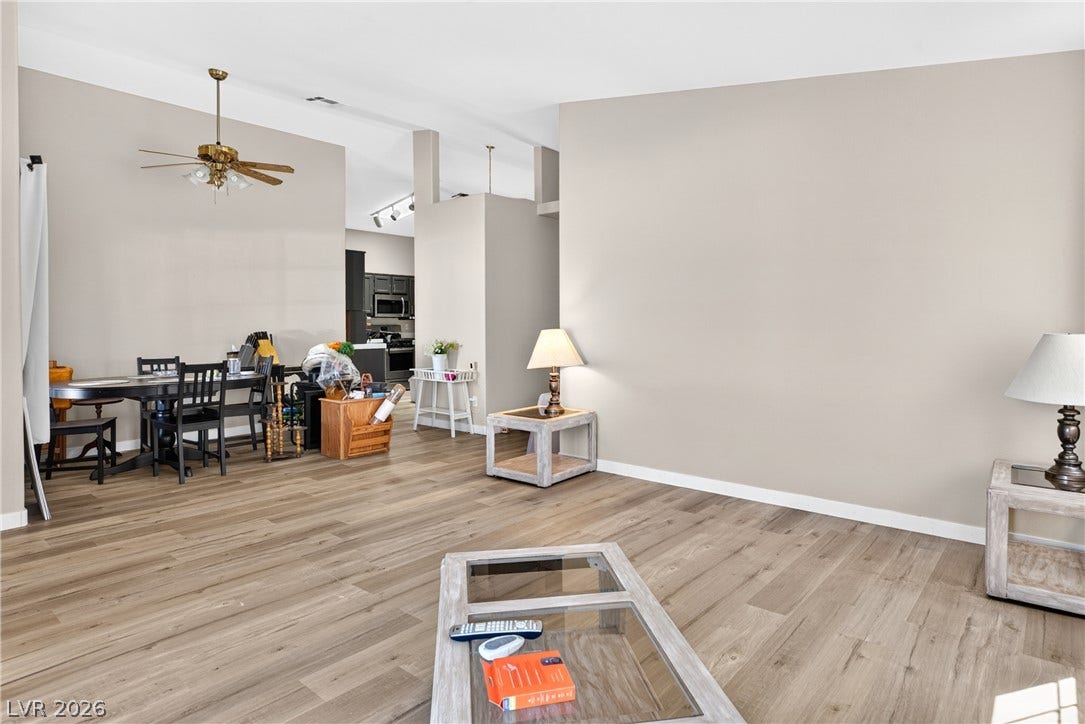 4633 Sophia Way, North Las Vegas, NV 89032 A spacious layout connects the living areas under high ceilings with handsome wood-look flooring.