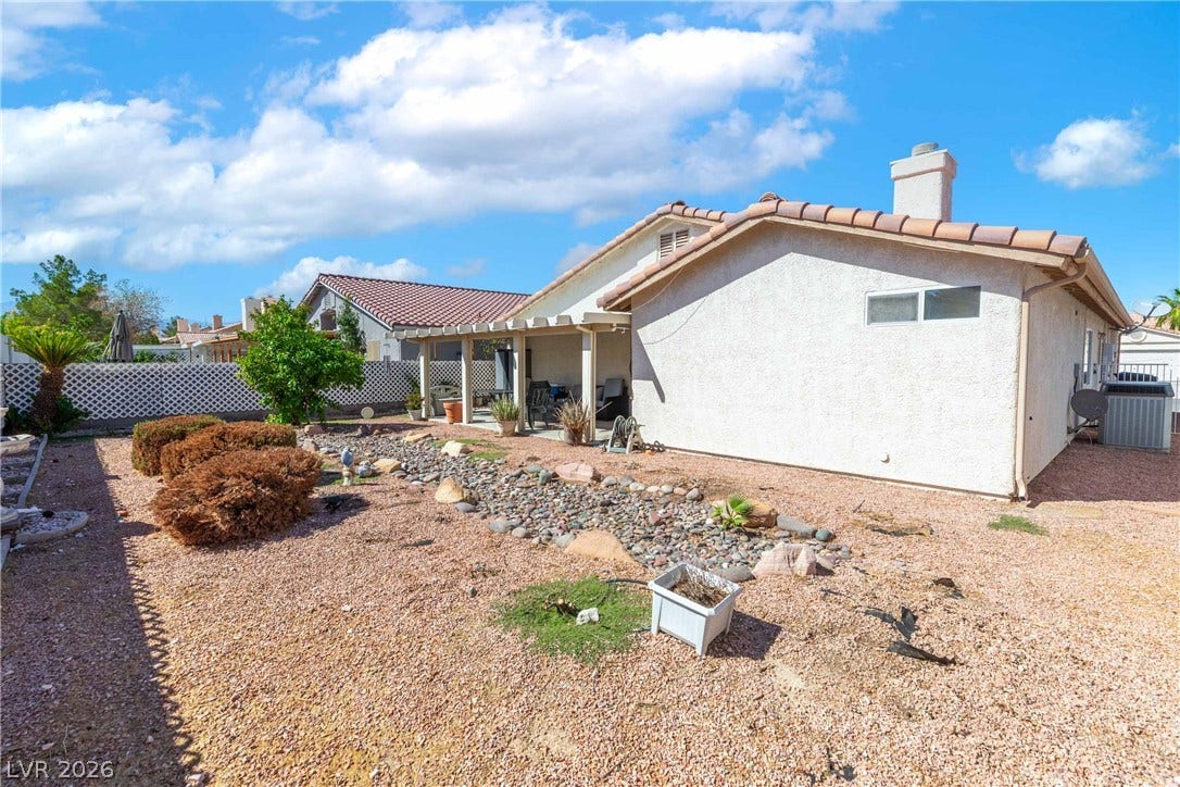 4633 Sophia Way, North Las Vegas, NV 89032 Low-maintenance desert landscaping and a covered patio define this inviting backyard space.