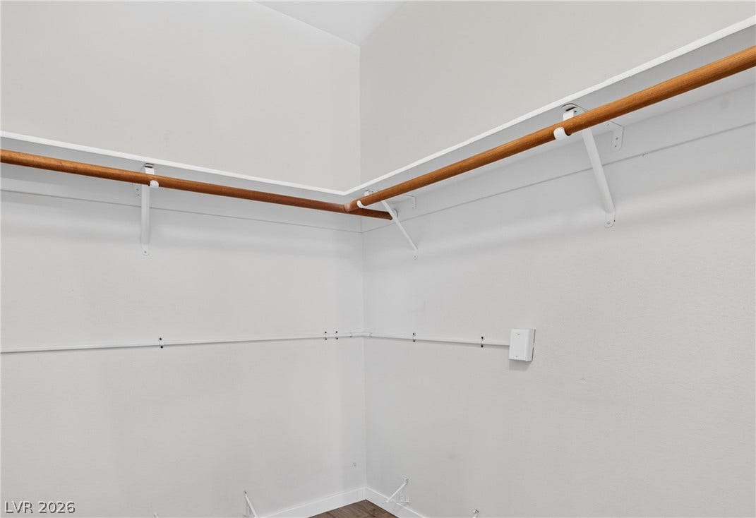 4633 Sophia Way, North Las Vegas, NV 89032 Ample closet space with sturdy built-in shelving and wooden hanging rods.