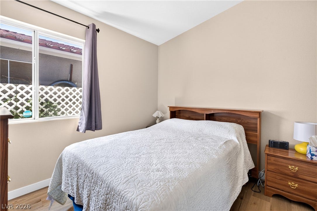 4633 Sophia Way, North Las Vegas, NV 89032 Smooth plaster walls and warm wood-style flooring create a cozy, relaxing environment.