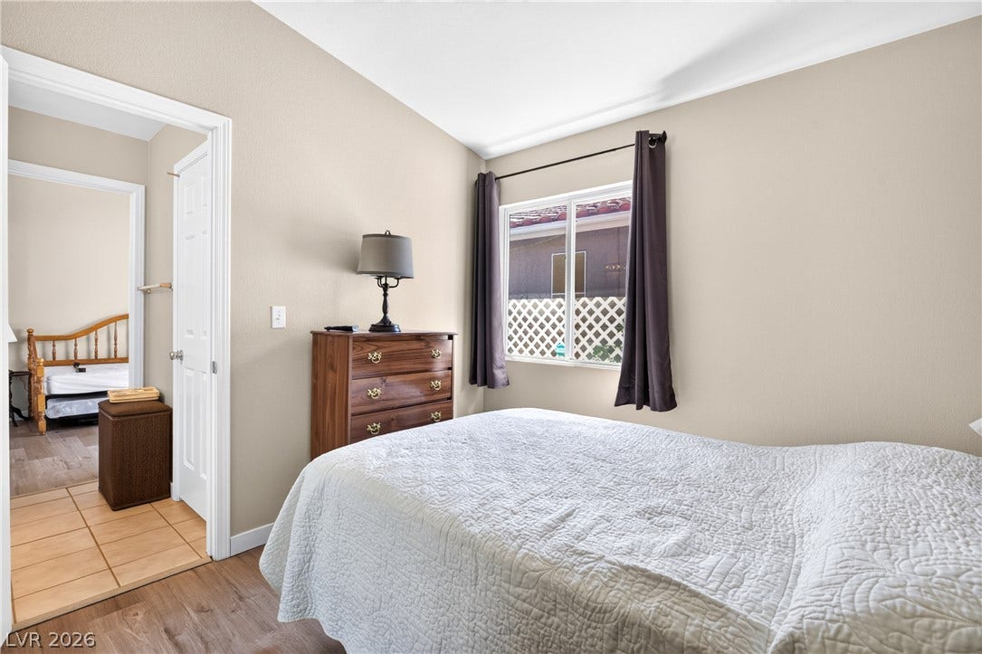 4633 Sophia Way, North Las Vegas, NV 89032 High vaulted ceilings and rich wood floors anchor this comfortable bedroom retreat.