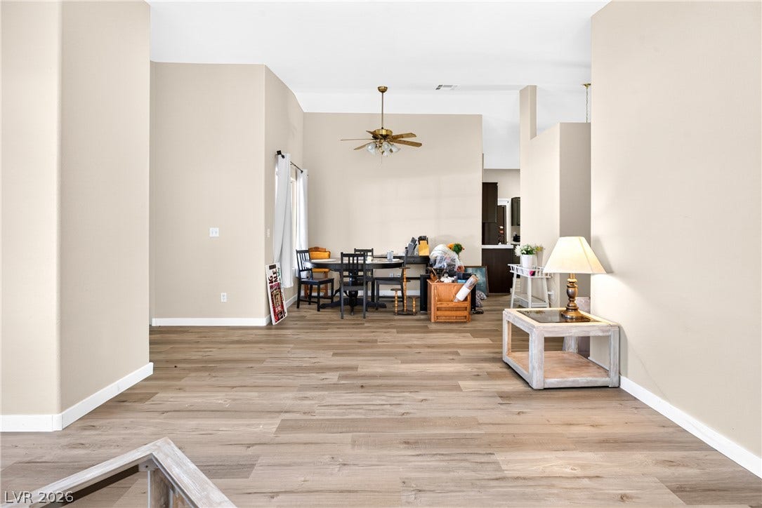 4633 Sophia Way, North Las Vegas, NV 89032 Gleaming wood-inspired floors flow through this light-filled dining space and open floorplan.
