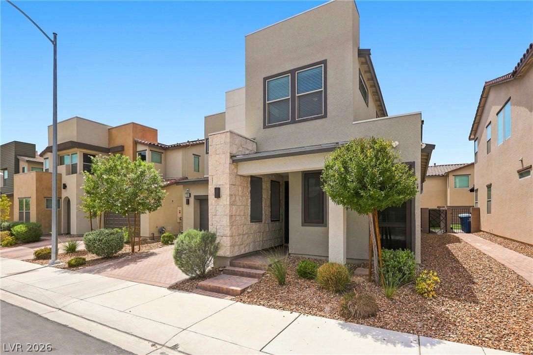 709 Emerson Creek Court, North Las Vegas, NV 89084 A contemporary facade showcases stone and stucco accents, complementing the meticulously maintained xeriscaping.