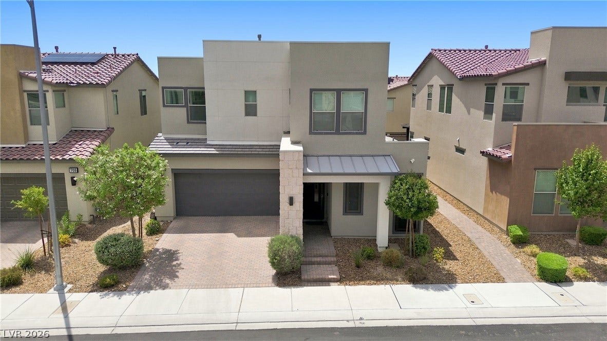 709 Emerson Creek Court, North Las Vegas, NV 89084 A contemporary home with clean lines and low-maintenance landscaping features a paver driveway and covered entry.