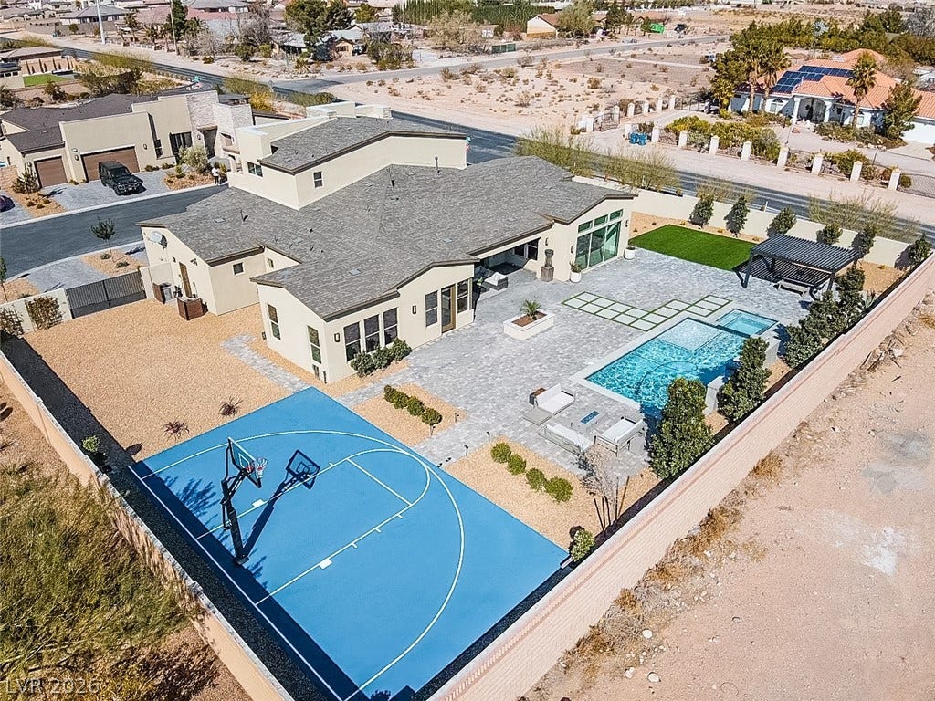 7851 W Wigwam Avenue, Las Vegas, NV 89113 Aerial view of residential area featuring a pool