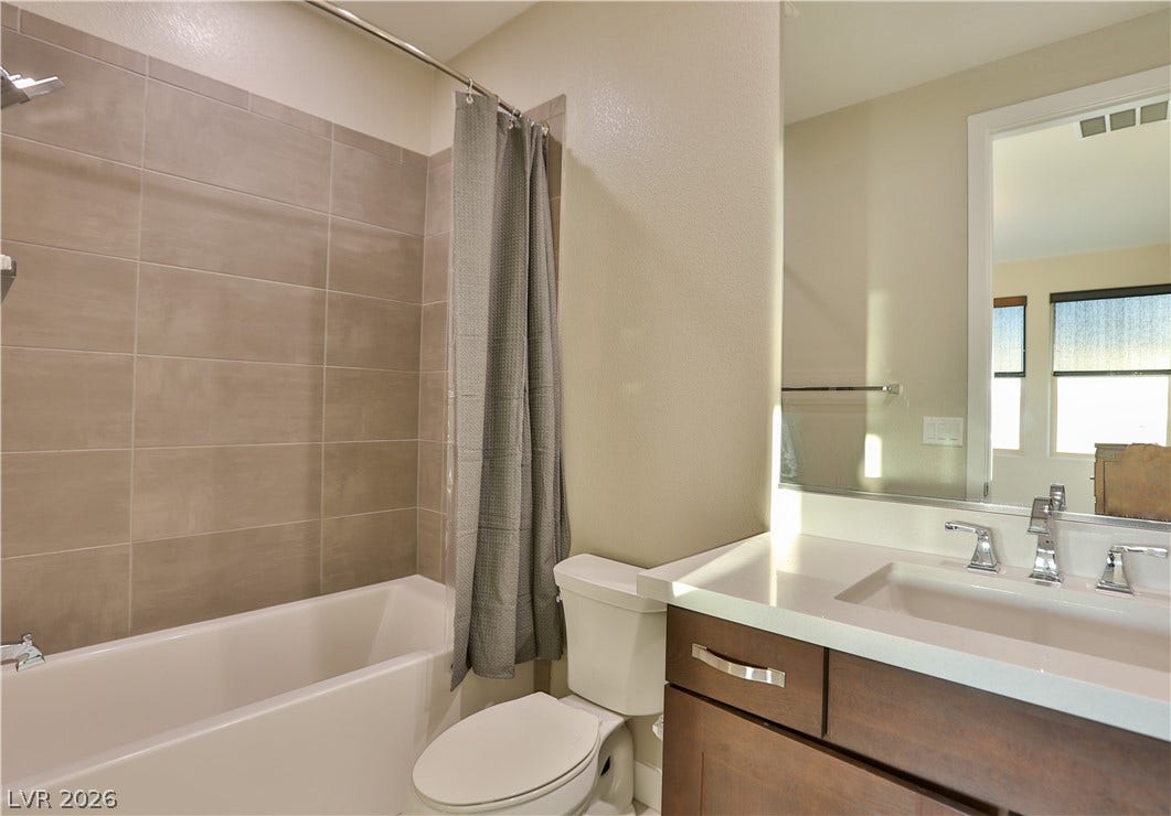 7851 W Wigwam Avenue, Las Vegas, NV 89113 Full bathroom with vanity and shower / bath combination with curtain