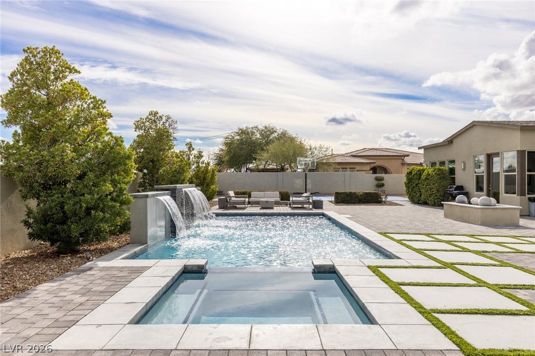 7851 W Wigwam Avenue, Las Vegas, NV 89113 View of pool with a patio area and a pool with connected hot tub