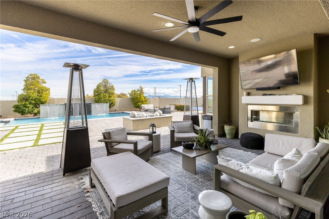 7851 W Wigwam Avenue, Las Vegas, NV 89113 Fenced backyard with a patio, an outdoor living space, and a ceiling fan