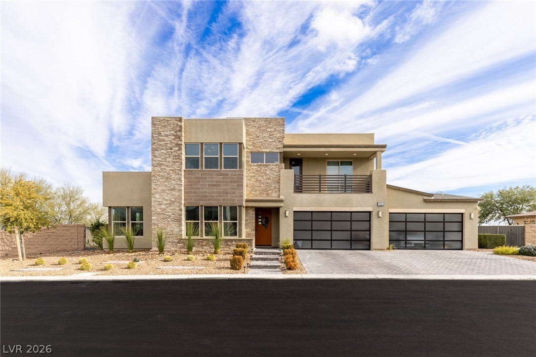 7851 W Wigwam Avenue, Las Vegas, NV 89113 Contemporary home with stone siding, stucco siding, a balcony, and decorative driveway