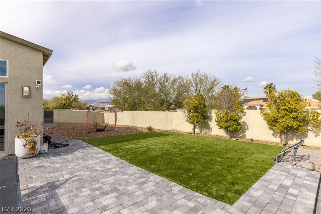 7851 W Wigwam Avenue, Las Vegas, NV 89113 Fenced backyard with a patio