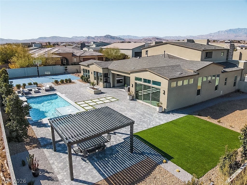7851 W Wigwam Avenue, Las Vegas, NV 89113 View of pool featuring a fenced backyard, a mountain view, a patio area, and a residential view