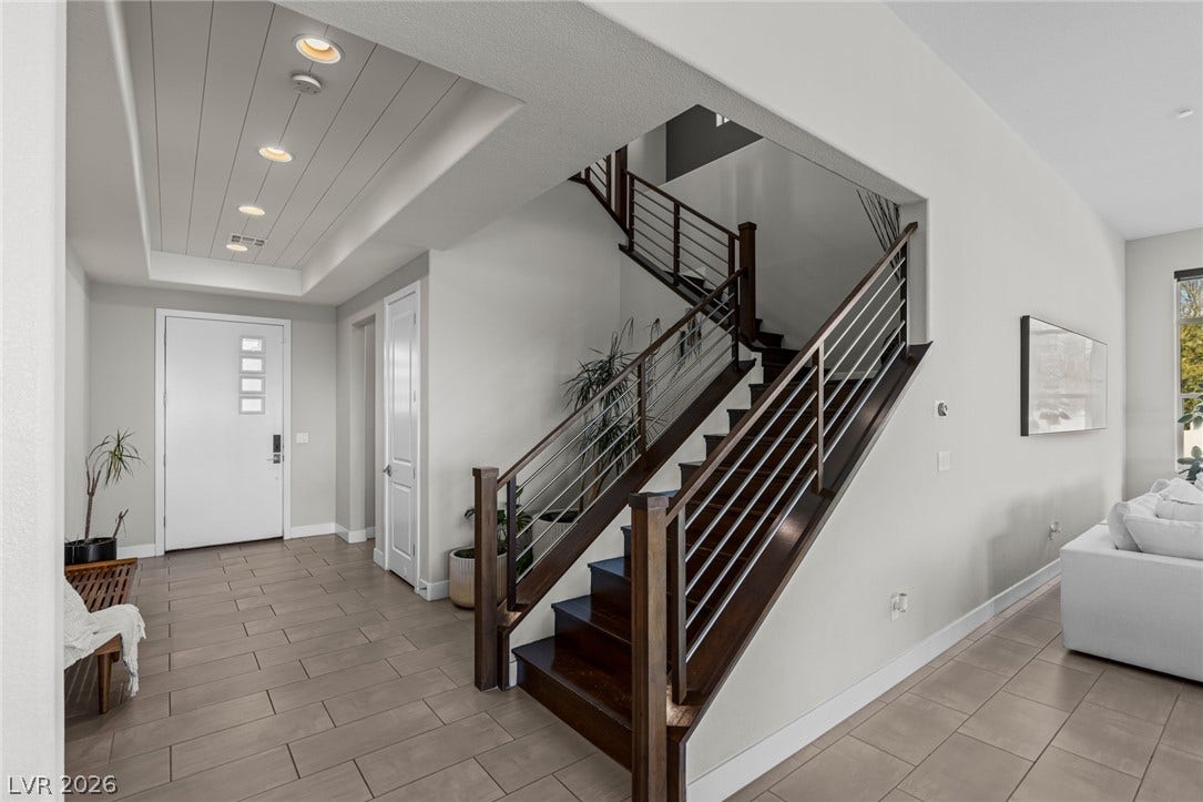 7851 W Wigwam Avenue, Las Vegas, NV 89113 Entryway featuring stairway, recessed lighting, and a tray ceiling