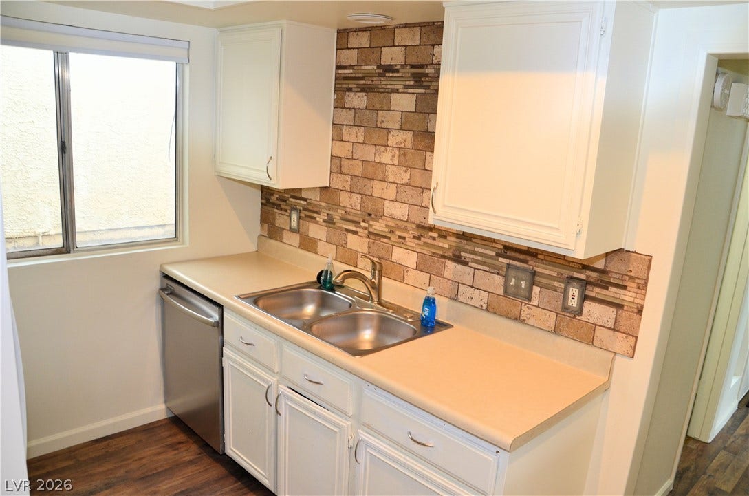773 Cathy Lane, Henderson, NV 89015 A classic brick pattern backsplash adds warmth and texture to this functional kitchen space.