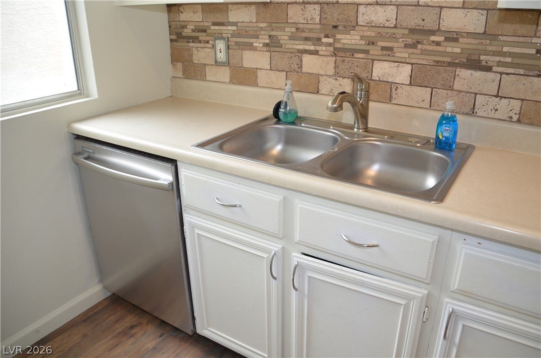 773 Cathy Lane, Henderson, NV 89015 Textured tile backsplashes pair with durable countertops and a dual basin sink.